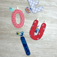 Naamslinger - letterslinger voor babykamer
